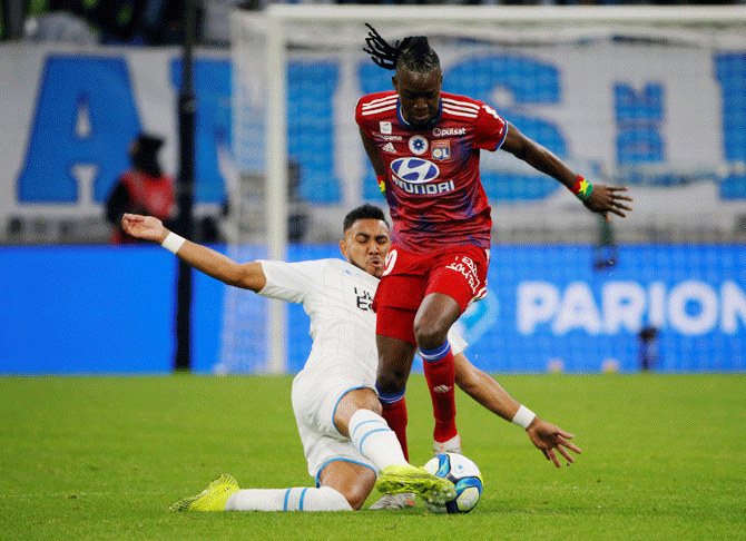 Olympique de Marseille's Dimitri Payet challenges Olympique Lyonnais' Bertrand Traore during their Ligue 1 match at Orange Velodrome, Marseille on Sunday