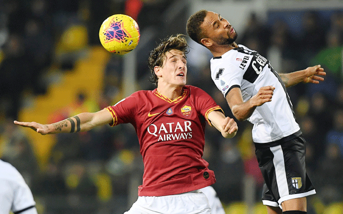 AS Roma's Nicolo Zaniolo and Parma's Hernani vie for an aeriel ball during their Serie A match at Stadio Ennio Tardini in Parma on Sunday