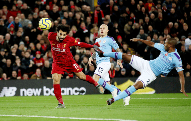Liverpool's Mohamed Salah scores their second goal against Manchester City during their EPL match at Anfield in Liverpool on Sunday 