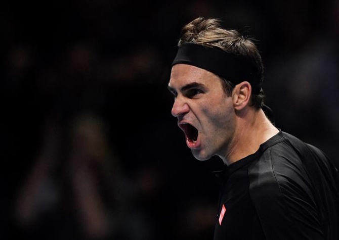 Roger Federer celebrates match point.