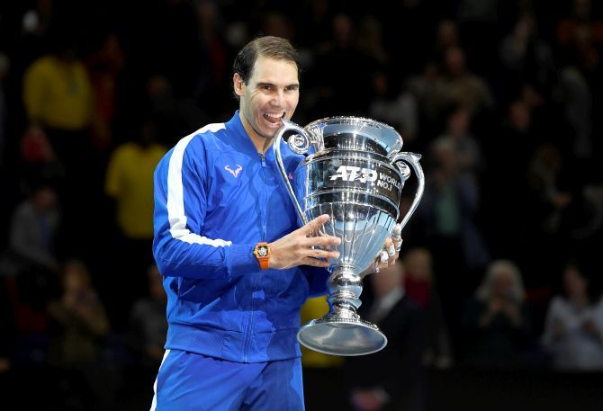 Spain's Rafael Nadal celebrates with the ATP World No.1 trophy after winning his group stage match against Greece's Stefanos Tsitsipas. He was announced the year-end World No 1. 