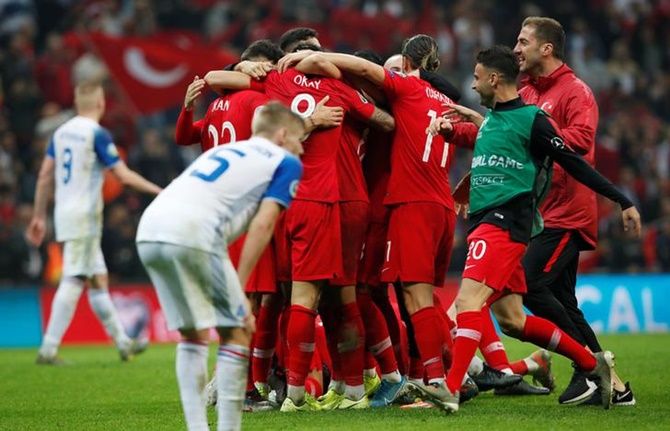 Turkey's players celebrate after holding Iceland goalless
