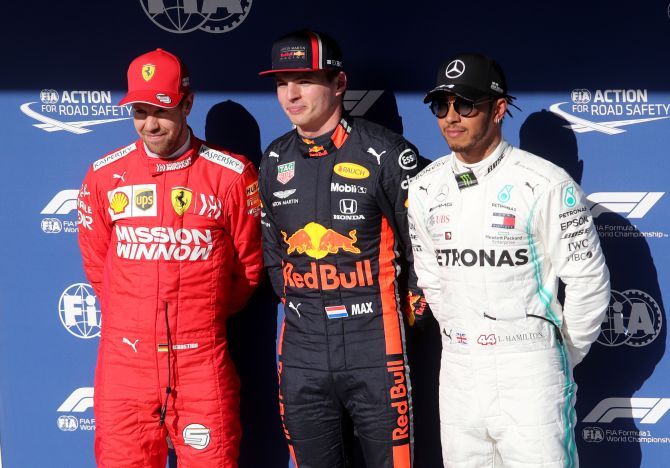 Red Bull's Max Verstappen (centre), Ferrari's Sebastian Vettel (left) and Mercedes' Lewis Hamilton after qualifying at the Brazilian F1 GP at Autodromo Jose Carlos Pace, Interlagos in Sao Paulo on Saturday 