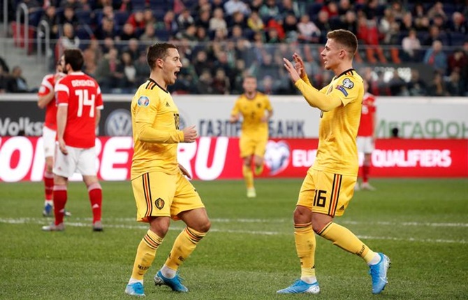 Eden Hazard celebrates scoring Belgium's second goal with Thorgan Hazard