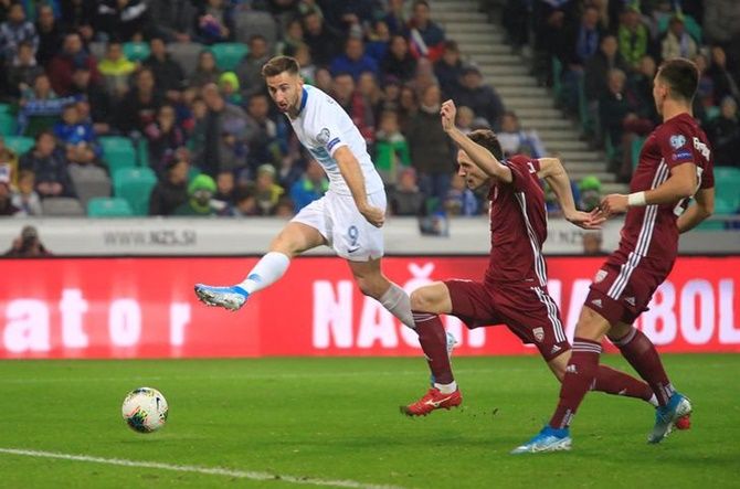 Slovenia's Andraz Sporar shoots at goal.