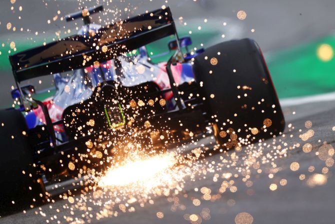 Sparks fly behind Daniil Kvyat's Scuderia Toro Rosso STR14 Honda on track during final practice of the Brazilian F1 Grand Prix on Saturday
