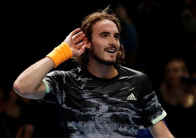 Greece's Stefanos Tsitsipas celebrates after defeating Switzerland's Roger Federer in the semi-final of the ATP Finals, at O2 Arena, in London, on Saturday.