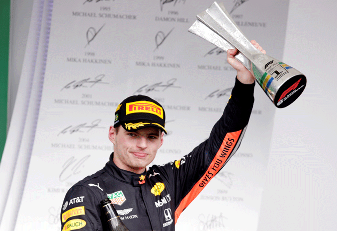 Race winner Red Bull's Max Verstappen celebrates on the podium with the trophy after the Brazilian F1 Grand Prix at Autodromo Jose Carlos Pace, at Interlagos in Sao Paulo on Sunday 