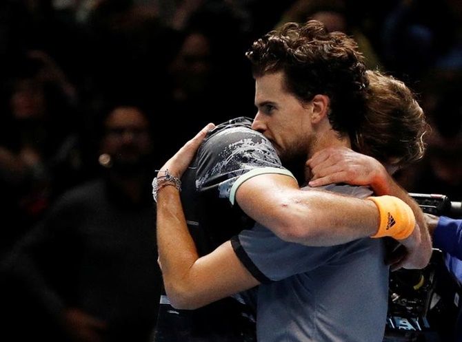  Stefanos Tsitsipas embraces Austria's Dominic Thiem after winning the ATP Finals.