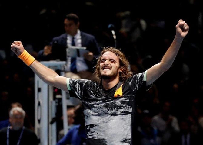 Greece's Stefanos Tsitsipas celebrates defeating Austria's Dominic Thiem and winning winning the ATP Finals, at tyhe O2 Arena, in London, on Sunday.