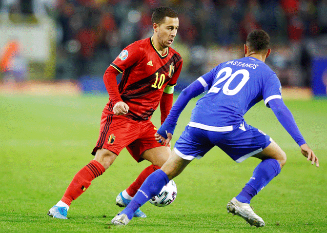 Belgium's Eden Hazard and Cyprus' Grigoris Kastanos vie for possession during their Euro 2020 Qualifier Group I match at King Baudouin Stadium, Brussels, Belgium, on Tuesday