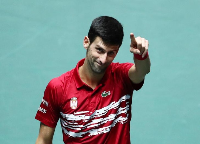 Serbia's Novak Djokovic celebrates winning his match against France's Benoit Paire.