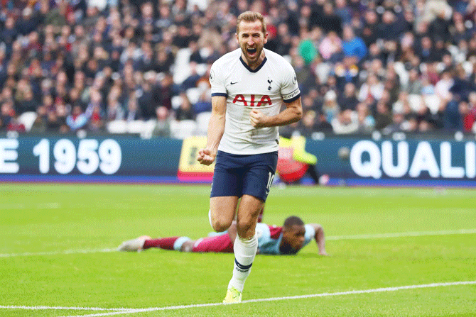 Tottenham Hotspur's Harry Kane celebrates after scoring the third goal against West Ham