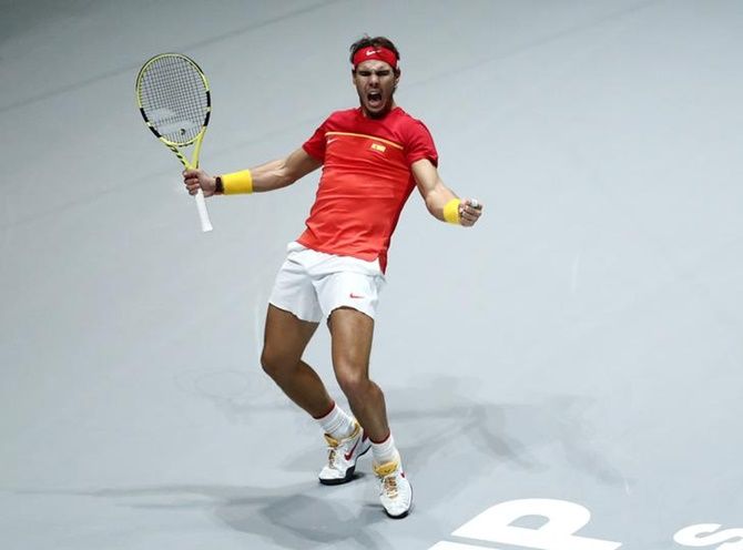 Rafael Nadal celebrates winning Spain's doubles match with Marcel Granollers-Pujol against Argentina's Maximo Gonzalez and Leonardo Mayer