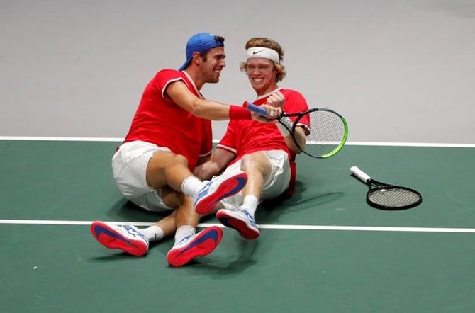  Russia's Andrey Rublev and Karen Khachanov celebrate after winning their doubles match against Serbia's Novak Djokovic and Viktor Troicki.