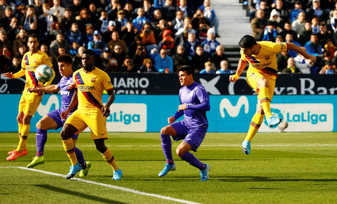 Barcelona's Luis Suarez heads in to score Barcelona's opening goal