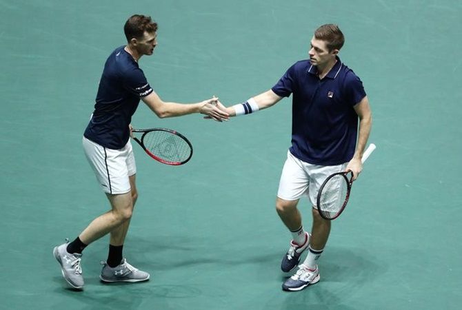 Britian's Jamie Murray and Neal Skupski react during their doubles match against Spain's Rafael Nadal and Feliciano Lopez