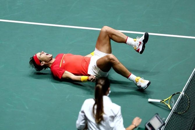 Spain's Rafael Nadal celebrates after he and Feliciano Lopez defeat Britian's Jamie Murray and Neal Skupski in the doubles match of the Davis Cup semi-final
