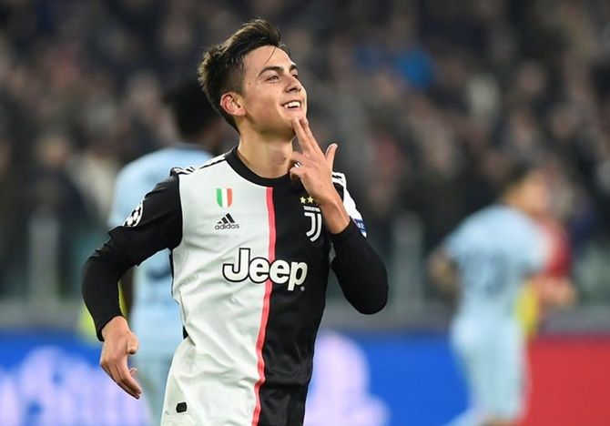 Paulo Dybala celebrates scoring from a free-kick for Juventus against Atletico Madrid.