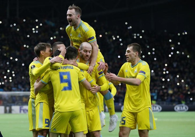 Astana players celebrate after Manchester United's Di'Shon Bernard scores an own goal, Astana's second, in Thursday's Europa League Group L match at Astana Arena, Nur-Sultan, Kazakhstan.