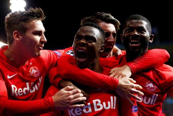 Patson Daka celebrates with teammates scoring FC Salzburg's first goal against Genk.