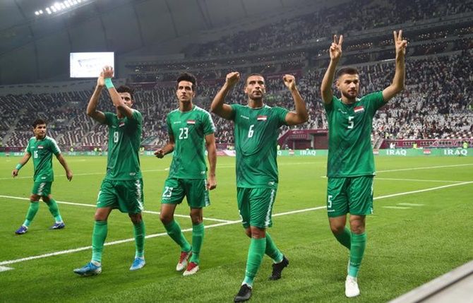 Iraq's Ali Atiyah, Ali Adnan, Maytham Jabbar and Ibraheem Bayesh celebrate after victory over the United Arab Emirates