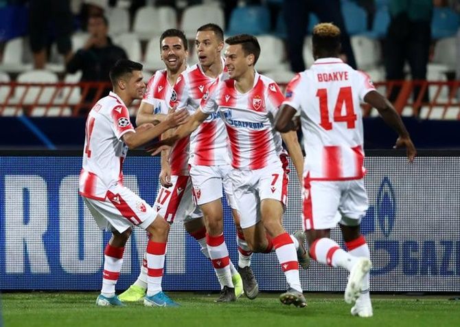 Milos Vulic celebrates scoring Crvena Zvezda's first goal with team mates.