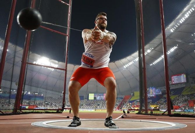 Poland's Pawel Fajdek goes through his routine during the men's hammer throw at the World Championships on Wednesday.