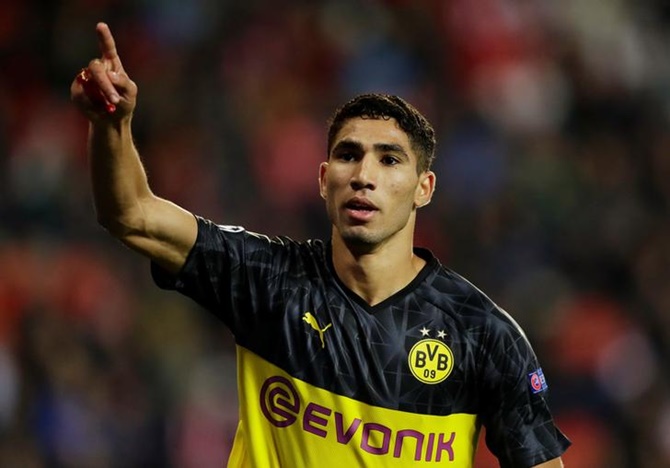 Achraf Hakimi celebrates scoring Borussia Dortmund's second goal.