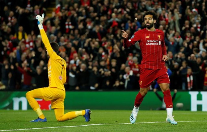 Mohamed Salah celebrates scoring Liverpool's fourth goal in Wednesday's UEFA Champions League match against FC Salzburg at Anfield.
