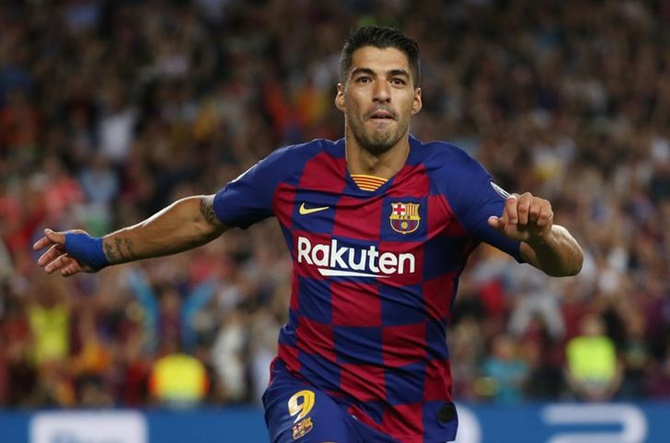 Luis Suarez celebrates scoring Barcelona's second goal against Inter Milan.