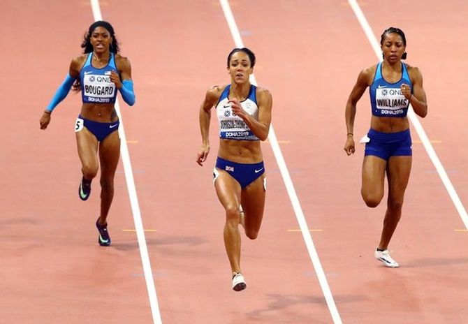Britain's Katarina Johnson-Thompson finishes ahead of Kendell Williams and Erica Bougard of the United States in the women's heptathlon 200 metres.