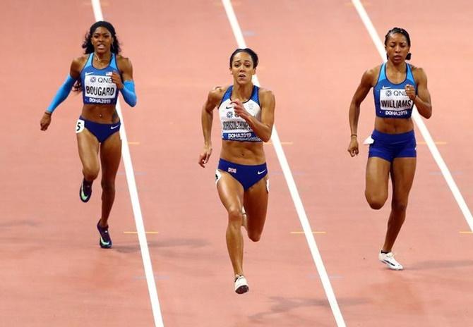 Britain's Katarina Johnson-Thompson finishes ahead of Kendell Williams and Erica Bougard of the United States in the women's heptathlon 200 metres.