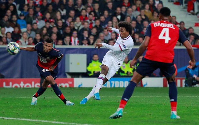 Willian scores Chelsea's second goal against Lille.