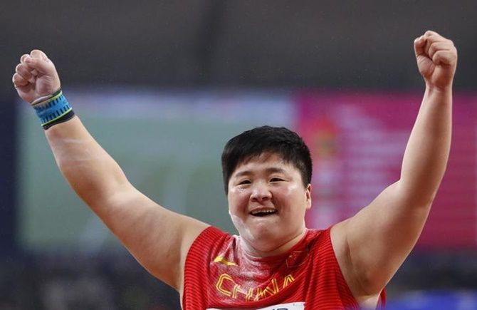 China's Lijiao Gong reacts after winning the women's shot put final.