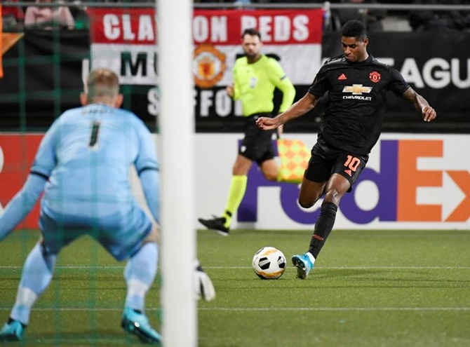 Manchester United's Marcus Rashford prepares to fire a shot at the AZ Alkmaar goal in the Europa Lesgue Group L match in Hague.