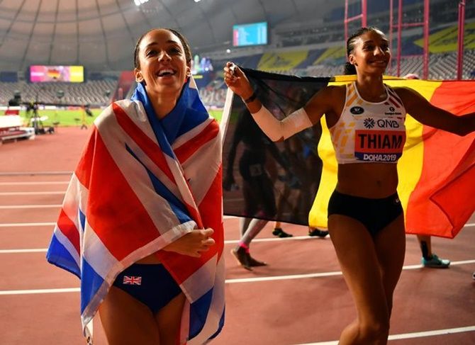Britain's Katarina Johnson-Thompson celebrates after winning gold with Belgium's silver medallist Nafissatou Thiam.