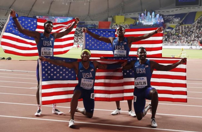Christian Coleman, Justin Gatlin, Michael Rodgers and Noah Lyles of the United States after winning gold in the men's 4x100 relay.