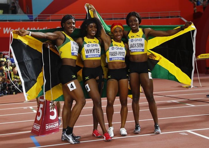 Jamaica's Shelly-Ann Fraser-Pryce, Natalliah Whyte, Jonielle Smith and Shericka Jackson celebrate winning the women's 4x100 metres gold.