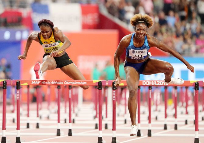 USA's Nia Ali competes against Jamaica's Danielle Williams en route to winning the Women's 100 Metres Hurdles gold