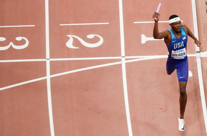 Rai Benjamin crosses the finish line to help USA win gold in the 4x400 Metres Relay final