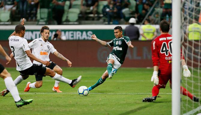 Palmeiras' Dudu scores the opening goal against Atletico Mineiro during their Brasileirao Series A match at Allianz Parque in Sao Paulo, Brazil, on Sunday