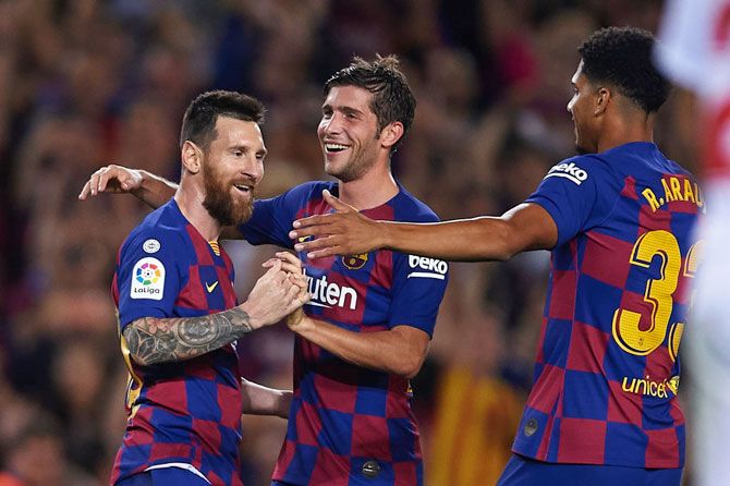 FC Barcelona's Lionel Messi celebrates after scoring against Sevilla FC
