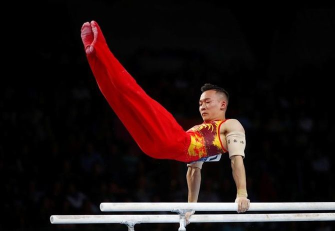 China's Xiao Ruoteng on the Parallel Bars during the men's team final.