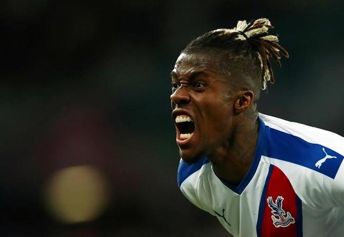 Crystal Palace's Wilfried Zaha reacts after wasting a chance during the Premier League match against West Ham United.