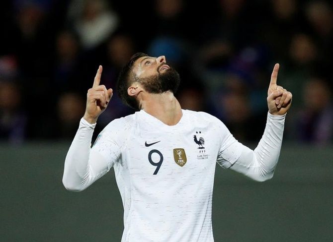Olivier Giroud celebrates scoring for France.