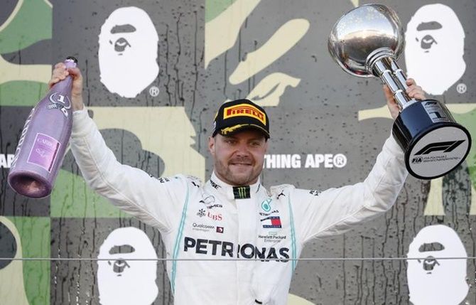 Valtteri Bottas of Mercedes celebrates with the trophy after winning the Japanese Grand Prix, at Suzuka Circuit, Japan.