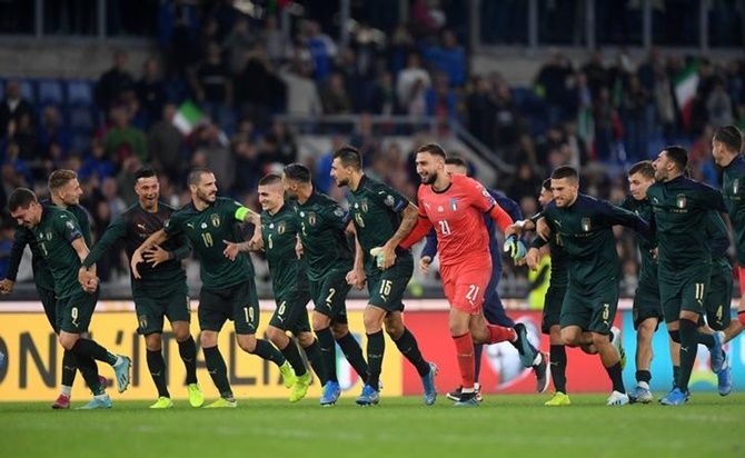 Italy's players celebrate after beating Greece and qualifying for Euro 2020 at the Stadio Olimpico, in Rome, on Saturday.
