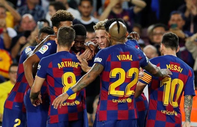 Barcelona's players celebrate a goal at Camp Nou, Barcelona.
