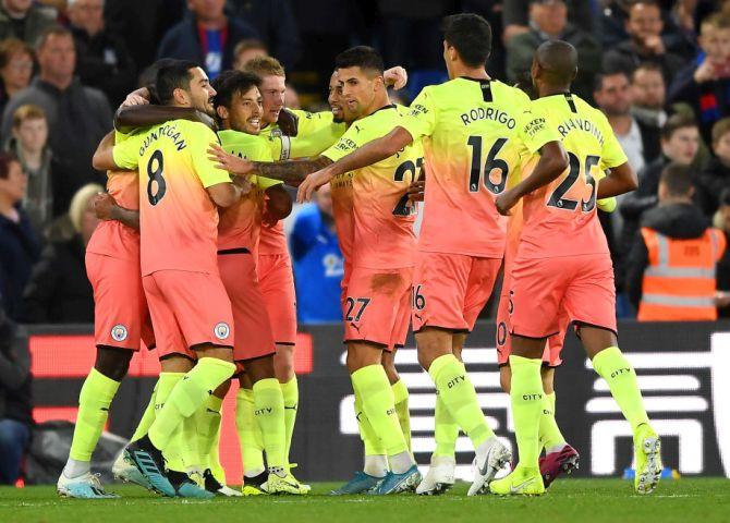 Manchester City's David Silva celebrates with teammates after scoring his team's second goal against Crystal Palace